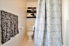 view of toilet and shower upstairs