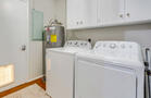 Laundry room w/ access to back porch & garage