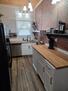 Full kitchen with dishwasher and large frig