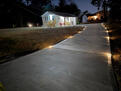 Lighted driveway toward house