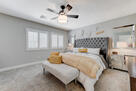 upstairs primary bdrm, ceiling fan, en suite
