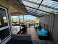 Covered lanai with seating and ocean view