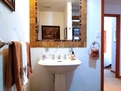 Hallway bath is conveniently across from smal