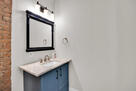 Half Bath with Brick Accent