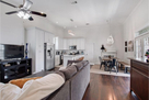 Open area with large sectional, 50 inch TV an