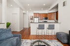 Open kitchen with breakfast-bar seating