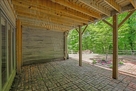 Walkout door under deck on lower level.