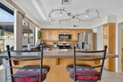 Breakfast bar with seating and track lighting