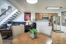 Dining table with Kitchen on left and living