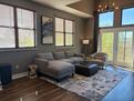 Spacious living room with 14 foot ceiling