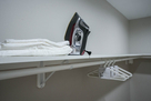 Walk-in closet with iron and ironing board