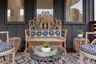 Cozy covered patio w/ elegant wicker seating