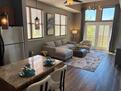 Brightly lit Living Room with large windows