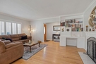 Living room showing front door and entry tabl