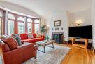 Living with fireplace and bay windows