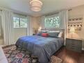 Light filled primary bedroom with king bed, s