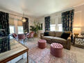 Stylish living space with a plush sofa, pink
