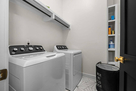 Large capacity washer & dryer on primary bedr