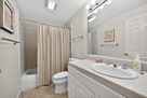 Full bath next to lower level twin bedroom