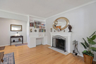 Living room showing bookcase with assortment 