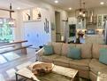 Spacious open living area. Sliding doors to o