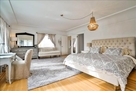 view of desk and bed in king bedroom