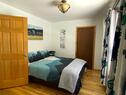 Main level bedroom 2 with 1 queen and 1 twin