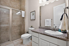 Bright bathroom with storage vanity