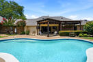 Resort-style pool with a covered patio.