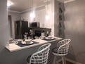 Bar opens to kitchen