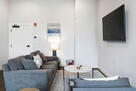 Relax in the fresh and tailored living space.