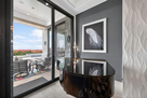 Grand piano between fireplace and pool lanai