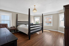 The main level bedroom has a 4-poster bed