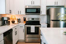 Prep, sip, or relax in a bright, airy kitchen
