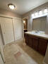 1st floor primary closet and vanity area
