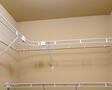 walk in closet next to bathroom and bedroom a