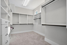 Walk in closet with built-in shelving