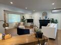 living room w/ reading corner & working desk