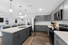 Modern kitchen with island, stainless steel a