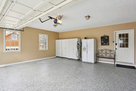 Garage with EV Charger, Refrigerator, cabinet