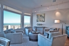 Relax in the plush chairs with leather ottoma