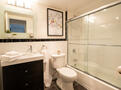 Spotless bathroom with modern vanity storage
