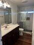 Full bathroom with vanity and glass shower