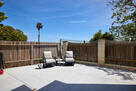 Back patio on ground, storage area