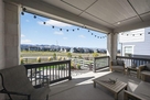 Furnished back porch w/ decorative lighting &