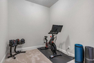 Home gym with peloton and weights