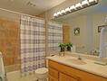Full bath with tile floors
