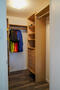 Spacious walk-in closet with custom built-ins