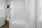 Bathroom with bathtub and shower