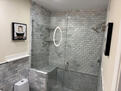 walk in glass shower with seat and shelving